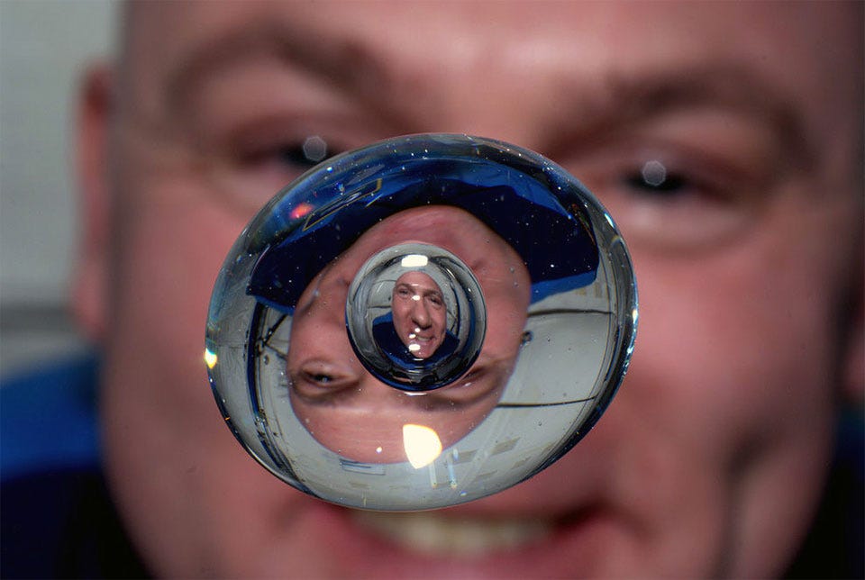 Astronaut Through Water Bubble : space