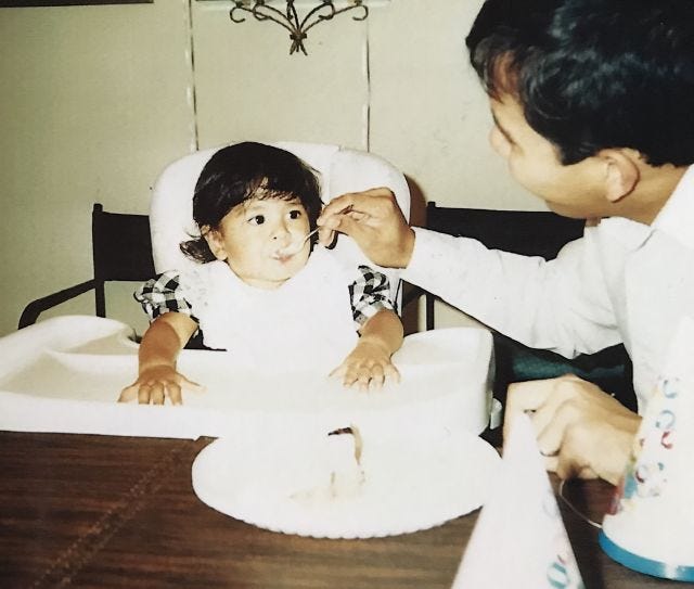 my dad feeding me cake when i was like 1 or 2