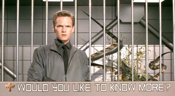 Still frame from the movie Starship Troopers that says: Would you like to know more?