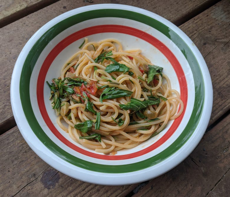 a bowl of spaghetti with fireweed leaves and more