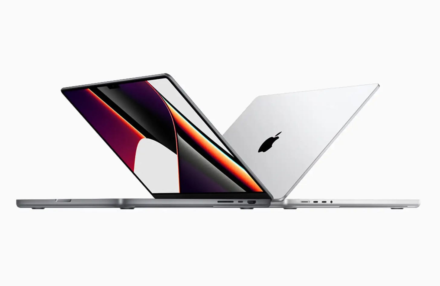Two Mac laptops back-to-back partially folded shut