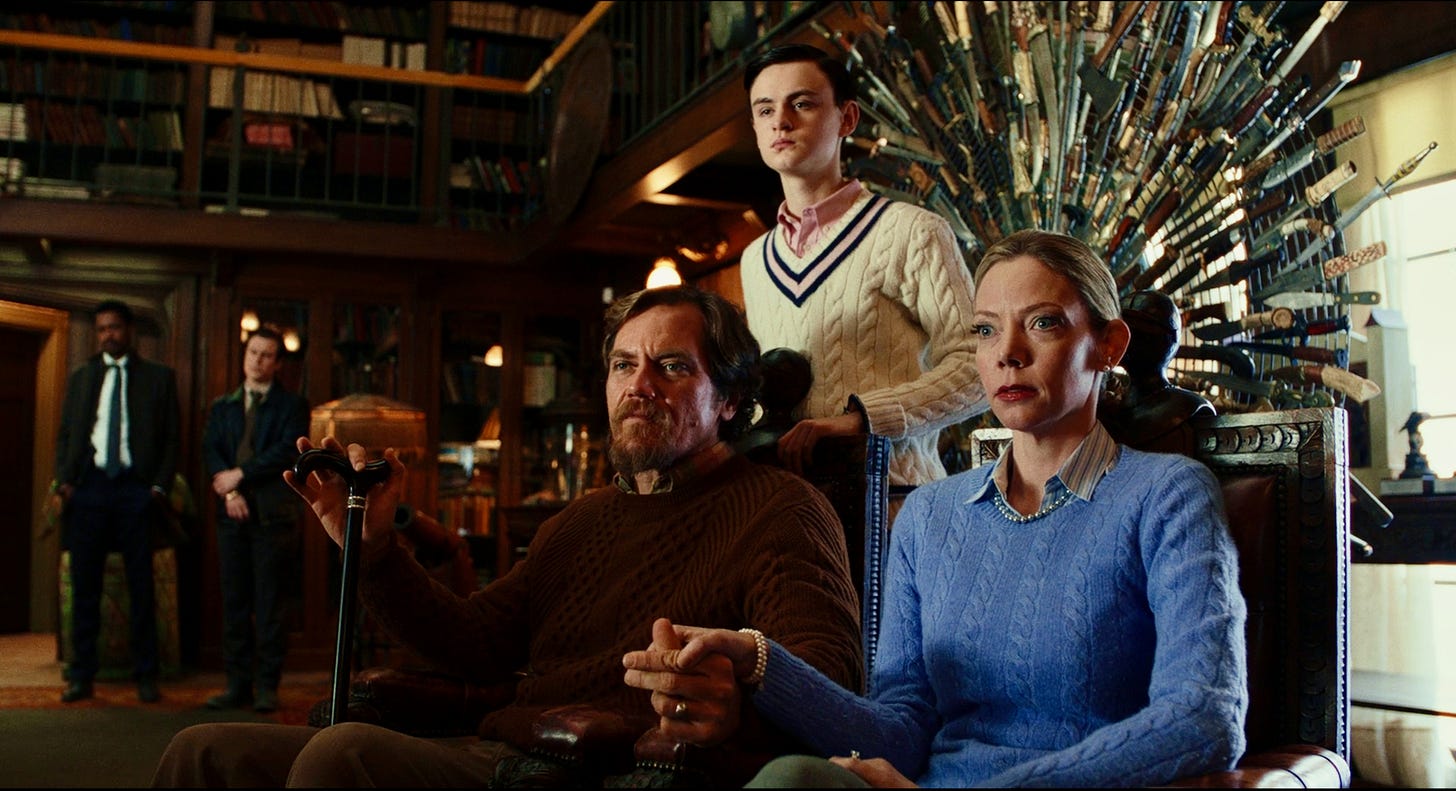 (l-r) Michael Shannon as Walt Thrombey, Jaeden Martell as Jacob Thrombey, and Riki Lindhome as Donna Thrombey in KNIVES OUT.