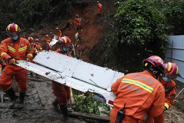 Recovering debris from the China Eastern Flight 5735 crash site in the Guangxi region of southern China on Thursday.