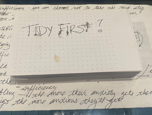 Stack of index cards with the messy label "Tidy First"