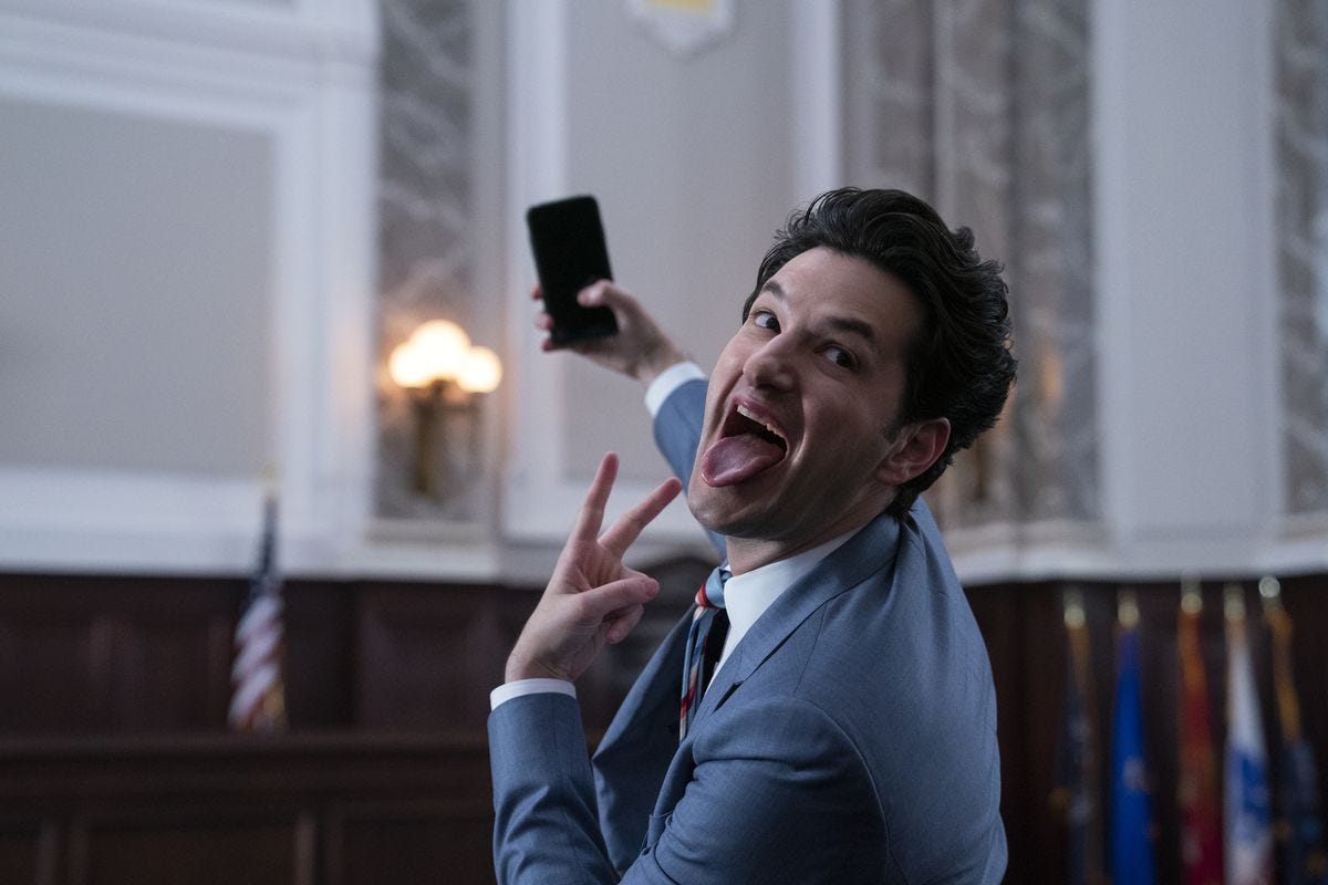 ben schwartz taking a selfie, sticking his tongue out and making a peace sign