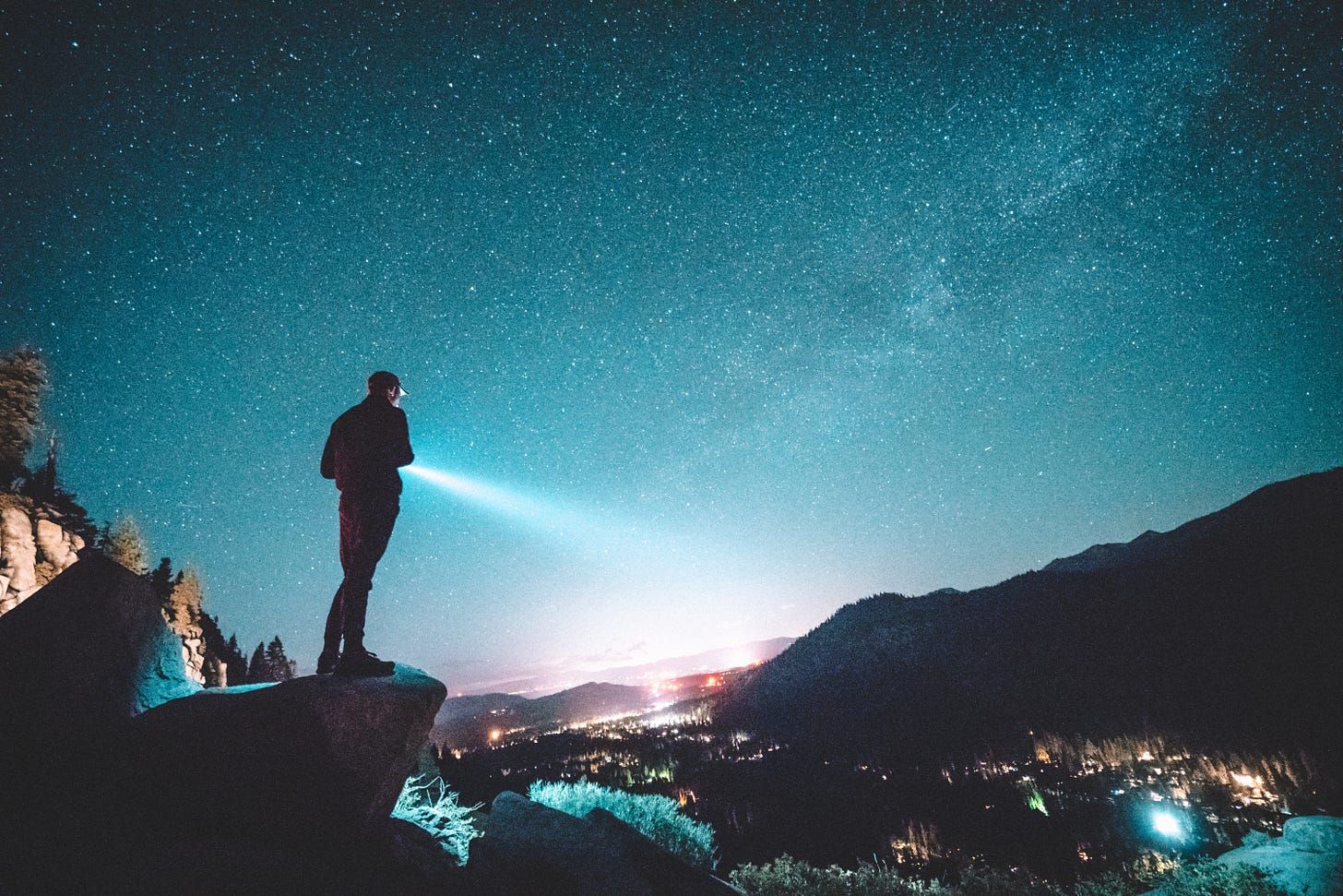 man standing near cliff photo