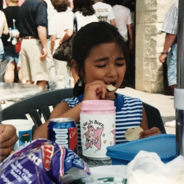 lil mia eating a chip