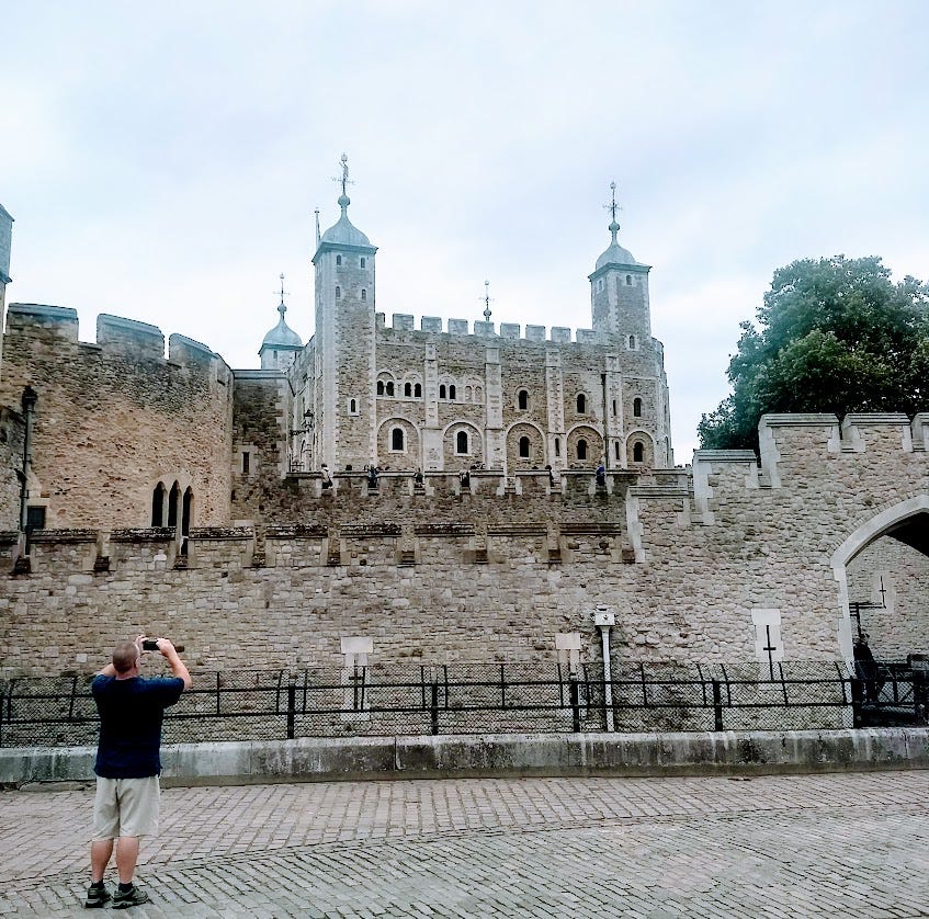 my husband taking a photo of the Tower on that first day in London
