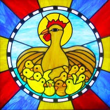 A stained glass window depicting a hen gathering a large group of chicks under her wings