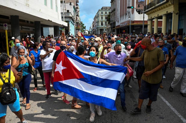 People take part in a demonstration to support the government of the Cuban President Miguel Diaz-Canel