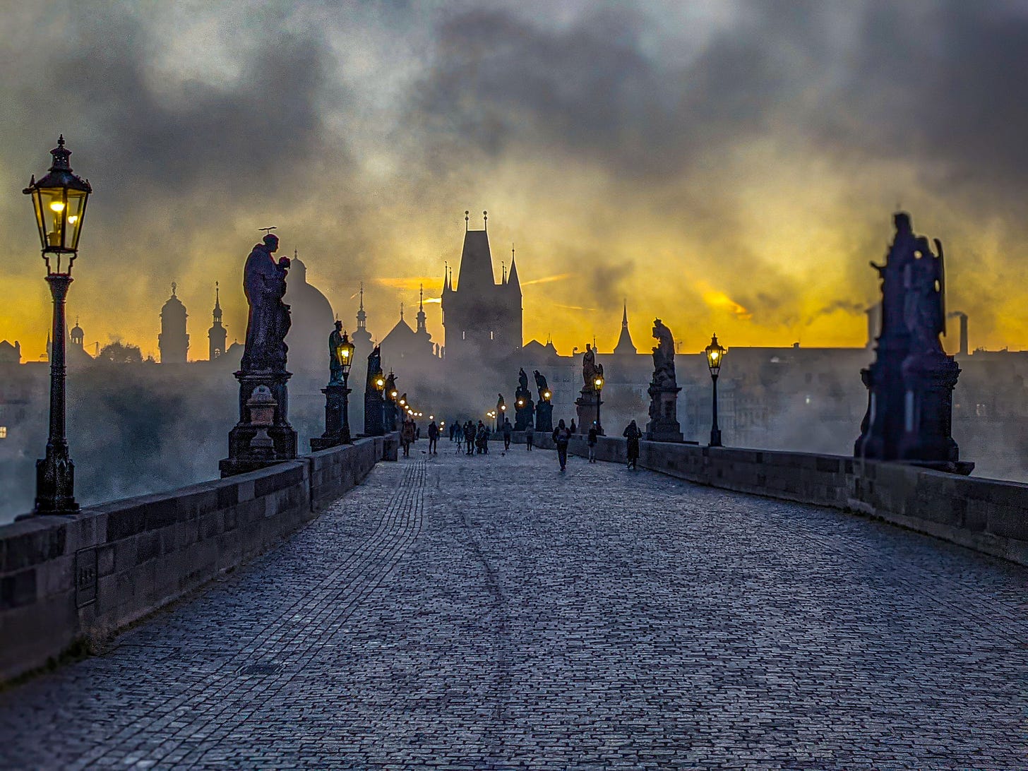 Another photo of the fog swirling across the Charles Bridge in Prague, Czechia. 