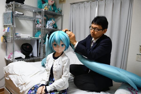 Akihiko Kondo at home in Tokyo with a doll of Hatsune Miku, the virtual pop star.