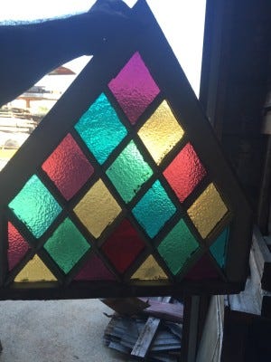 Great example of a piece of antique stained glass to build a house around.