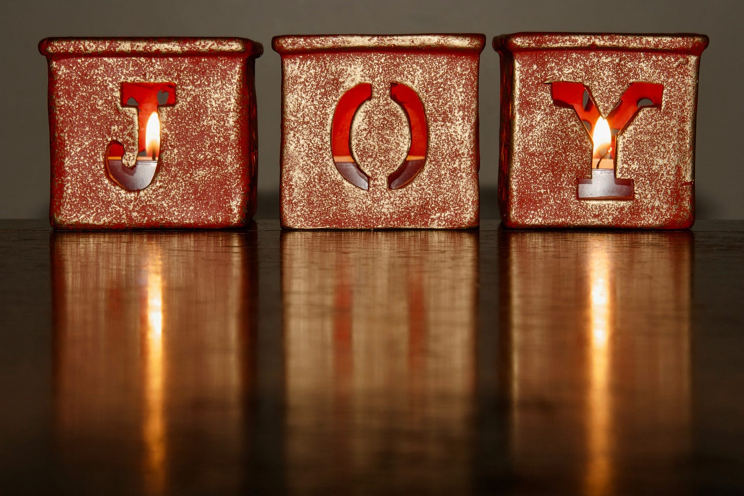The candles that spell out "Joy."