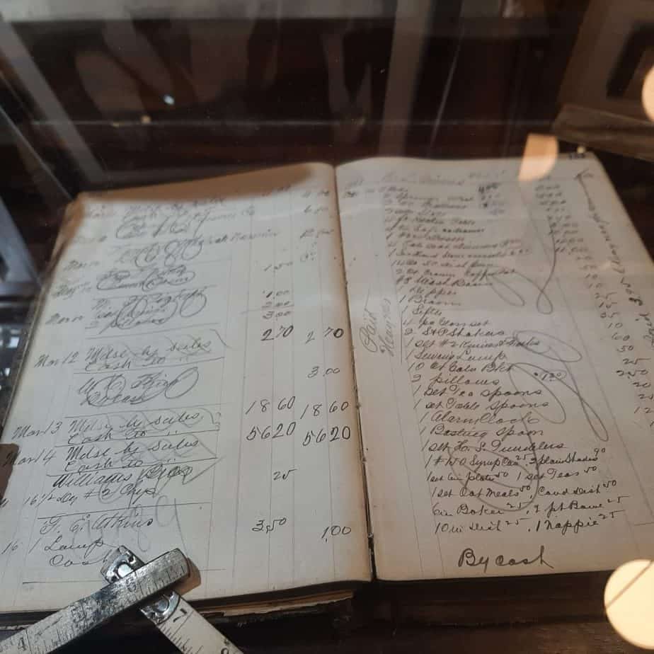 Old ledger book in a display case at Harrison Brothers Hardware store.