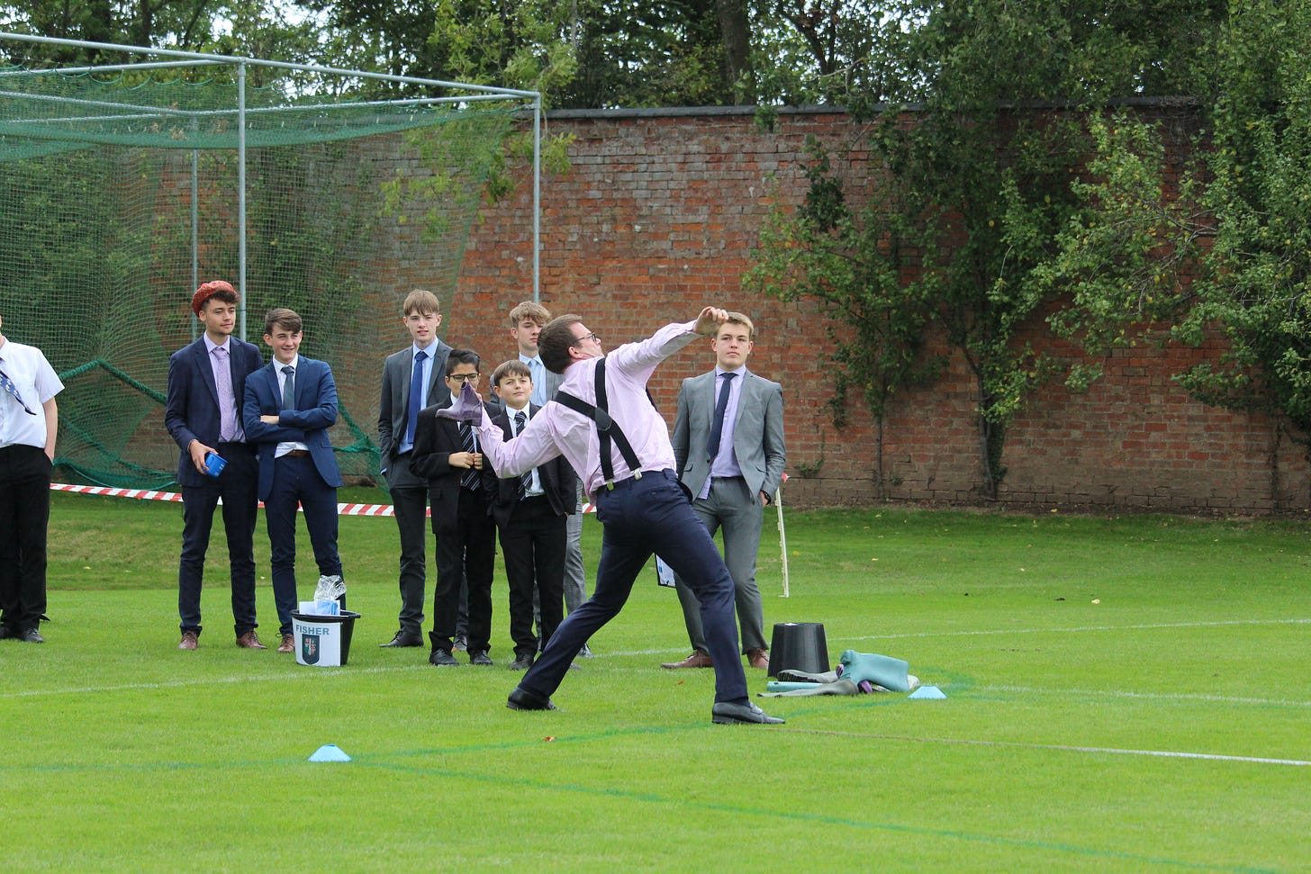 Princethorpe’s headmaster making the winning throw at the 2019 welly wanging competition. Picture supplied by Princethorpe College.