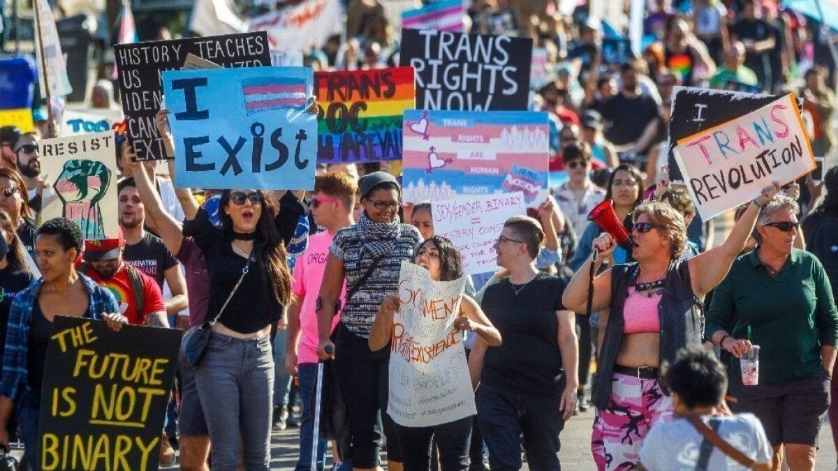 Hundreds rally to preserve transgender rights, recognition - The San Diego  Union-Tribune