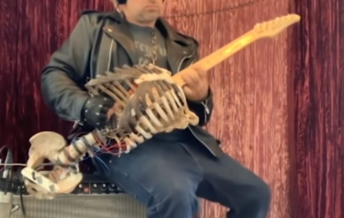 An electric guitar made from a real human skeleton.