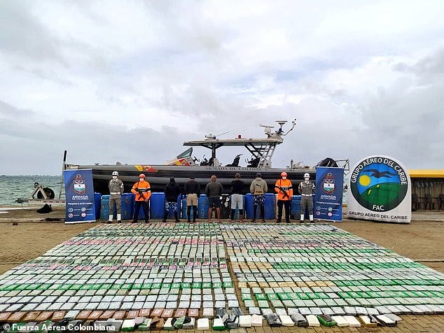 Pictured: Colombia's Navy retrieves a ton and a half of cocaine packages. According to a report, more than 260,000 Colombians have died as a result of the war on drugs