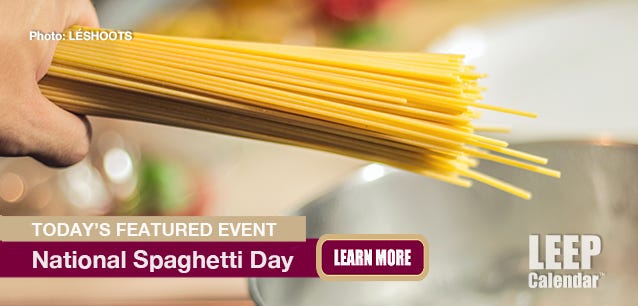 Spaghetti pasta in a hand