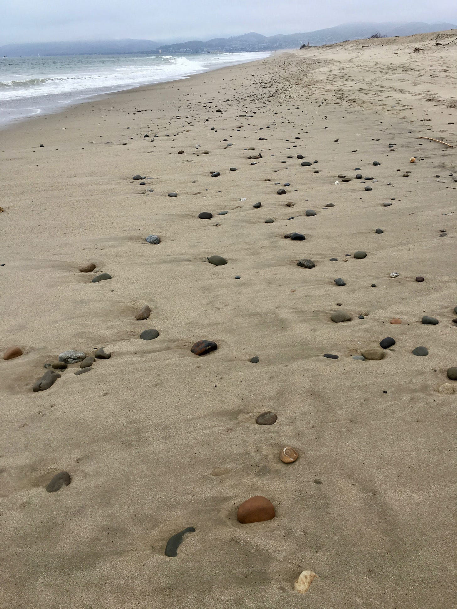Beach stones in a rhythmic pattern