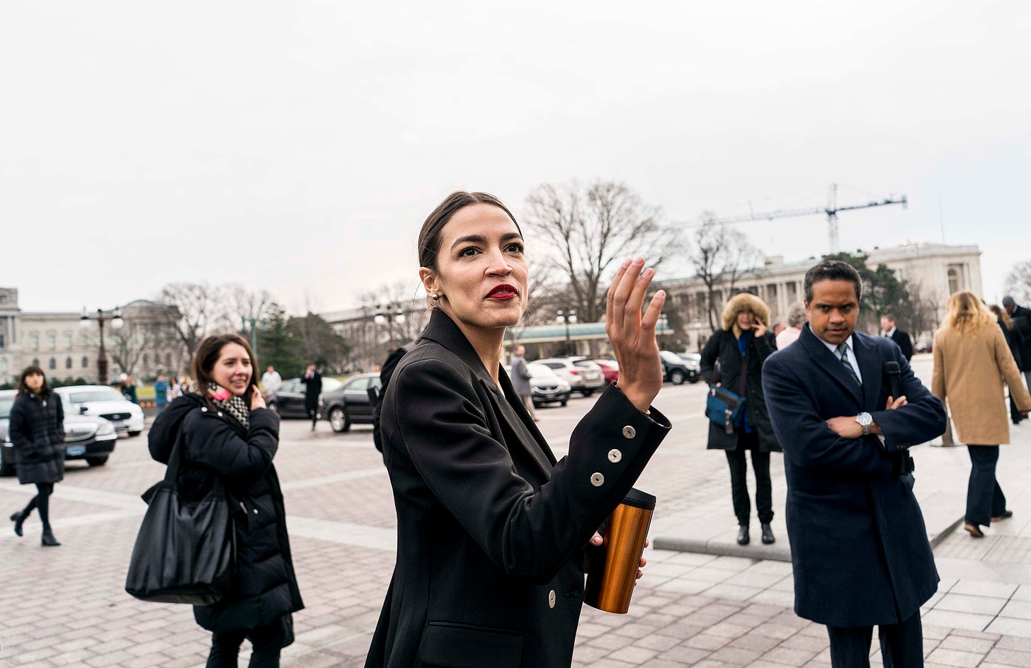 AOC joins Biden's climate policy panel