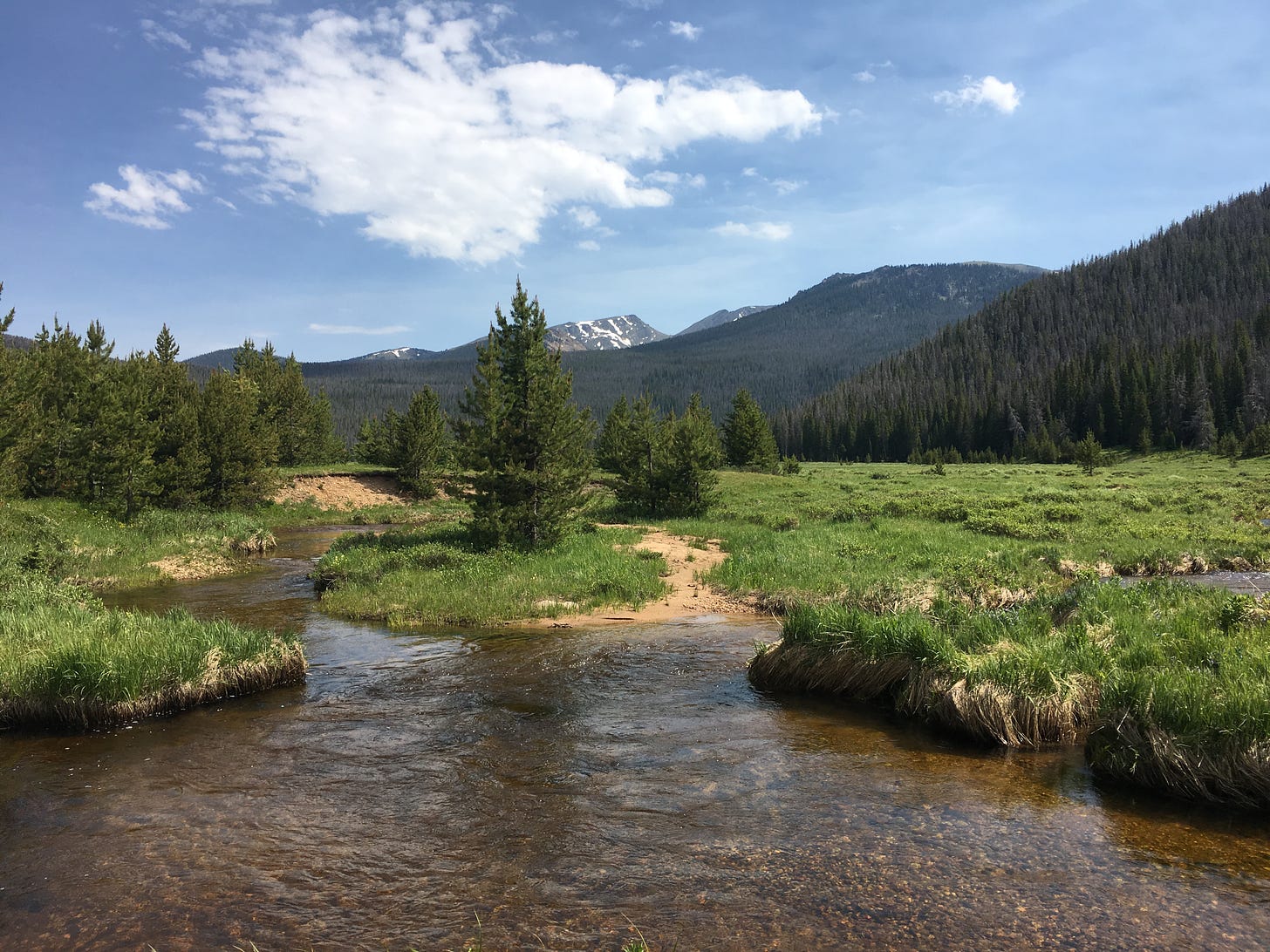 beautiful scene of a stream in the Rocky Mountain National Park