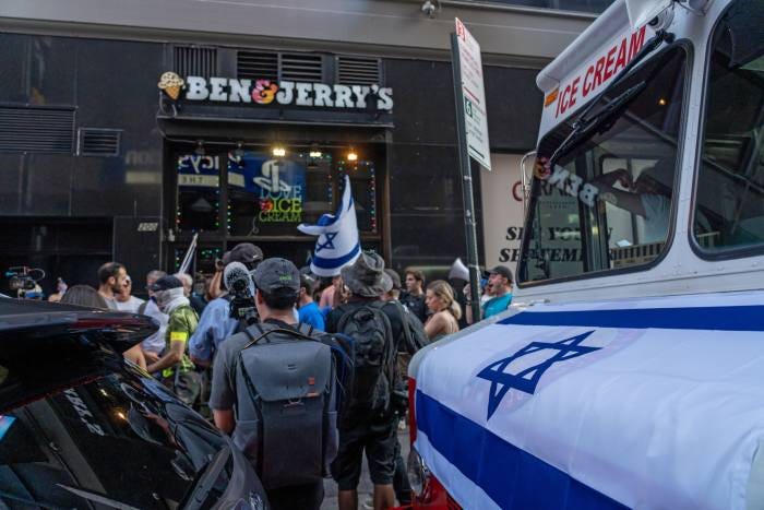 Pro-Israel demonstrators protest outside a Ben & Jerry’s store in New York after the company announced it intended to end its franchise deal in Israel to stop its product being sold in occupied Palestinian territories