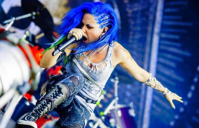 Alissa White-Gluz screaming while performing live with Arch Enemy