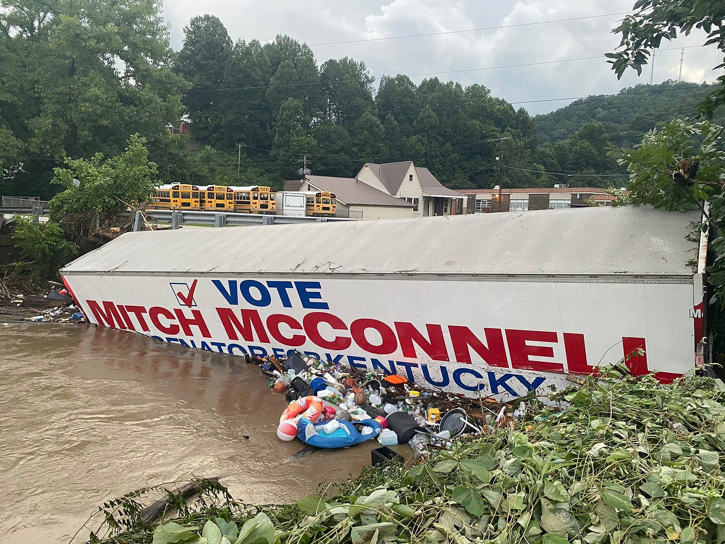 Vote Mitch McConnell sign submerged by catastrophic flood