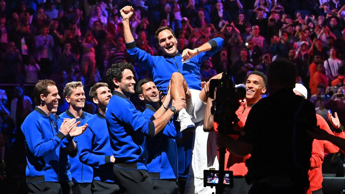 Novak Djokovic and other members of Team Europe and Team World lift Roger Federer on their shoulders.