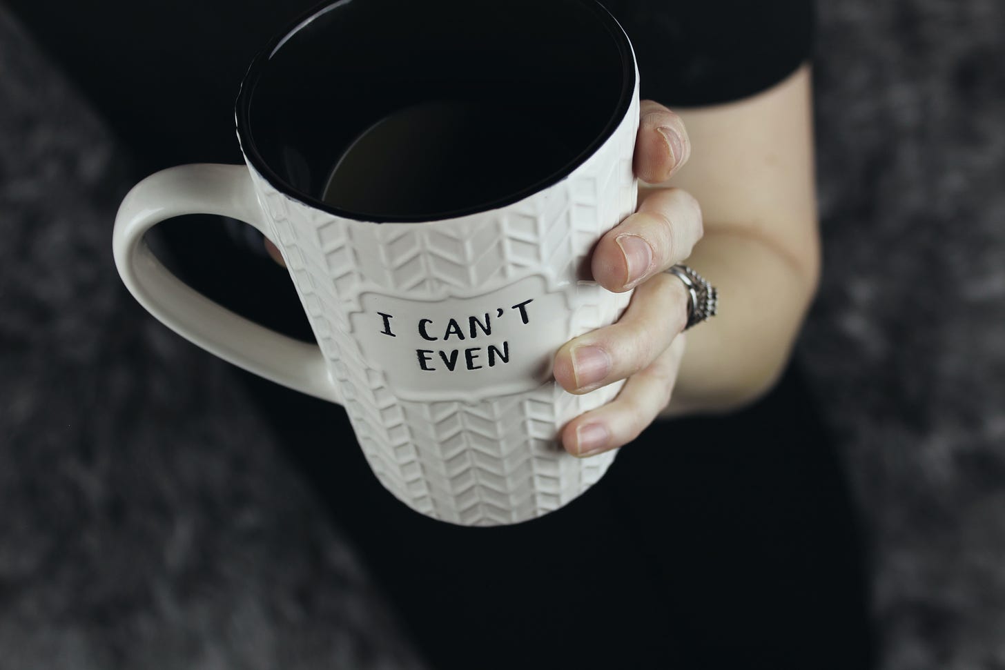 A coffee cup with the slogan ‘I can’t even’. Photo by Jen Theodore on Unsplash