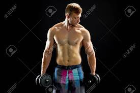 Concentrated Man Doing Dumbbell Workout. Well Trained Body With Bulky  Muscles. Sport Equipment And Weightlifting. Stock Photo, Picture And  Royalty Free Image. Image 91959880.