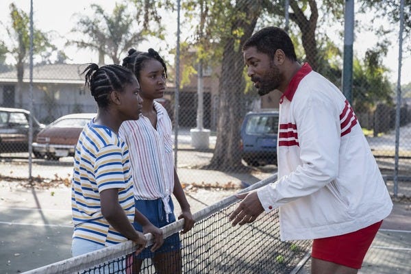 From left, Demi Singleton as Serena, Saniyya Sidney as Venus and Will Smith as the future tennis stars’ father, Richard Williams, in “King Richard.” Credit: Chiabella James/Warner Bros