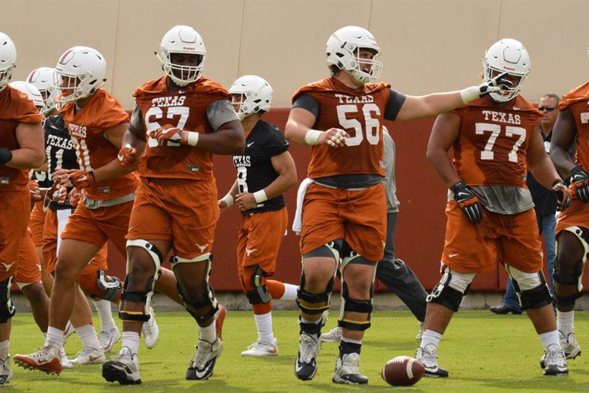Herb Hand focusing on technique with Texas OL - Burnt Orange Nation