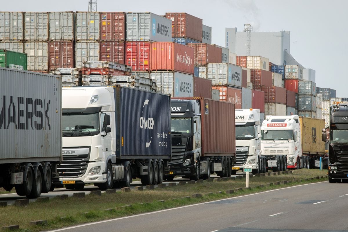 Trucks lined up next to shipping containers idled due to Russia sanctions, at the Port of Rotterdam in Rotterdam in March.