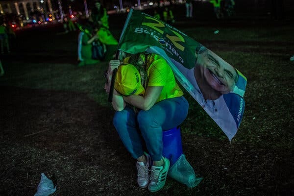 Supporters of President Jair Bolsonaro reacting as Luiz Inácio Lula da Silva took the lead in the election on Sunday night in Brasília.