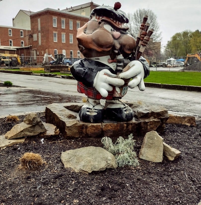 Groundhog statue playing bagpipes