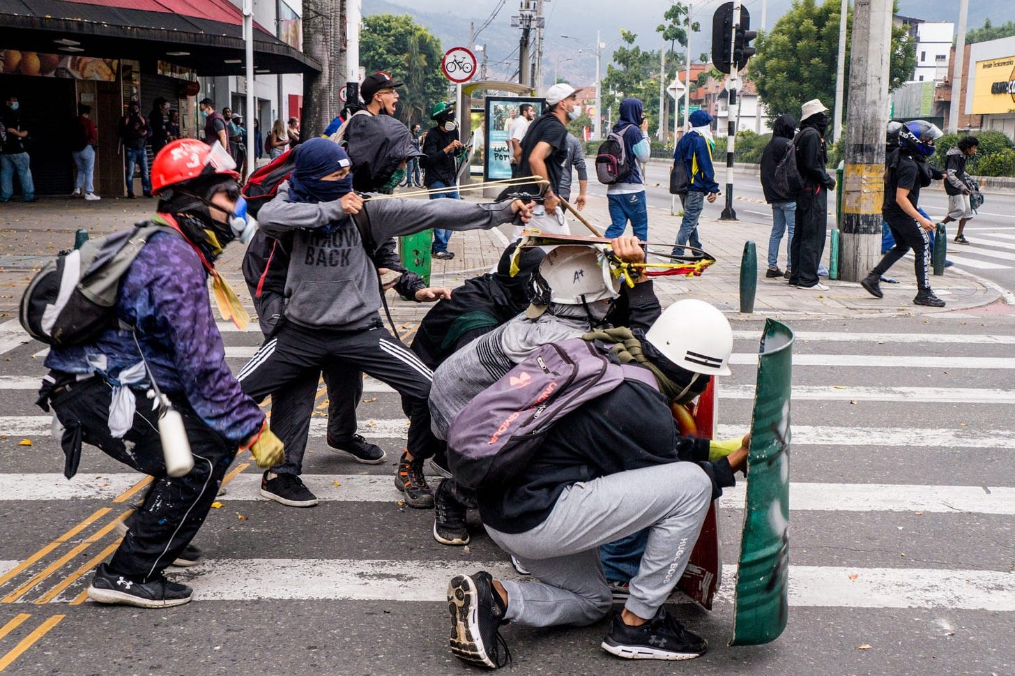 Front line protestors in Medellin, Colombia in 2021. Photo credit: Roger.Rondon / Shutterstock.com
