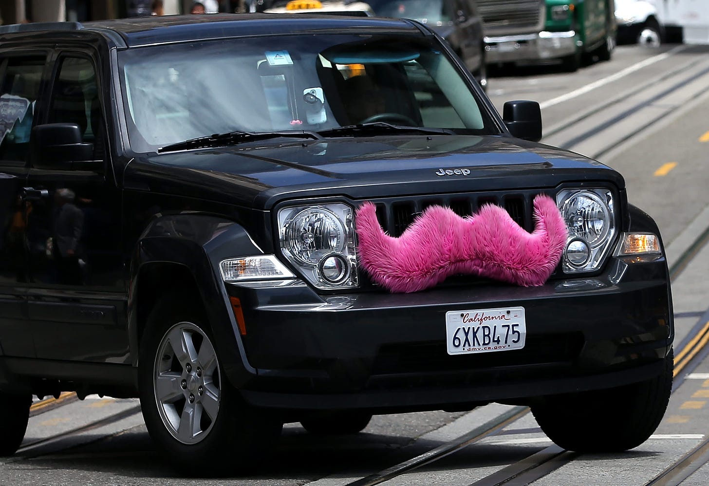 Lyft drops its quirky traits to compete with Uber