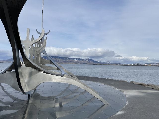 Sun Voyager sculpture with view of Flaxa bay 