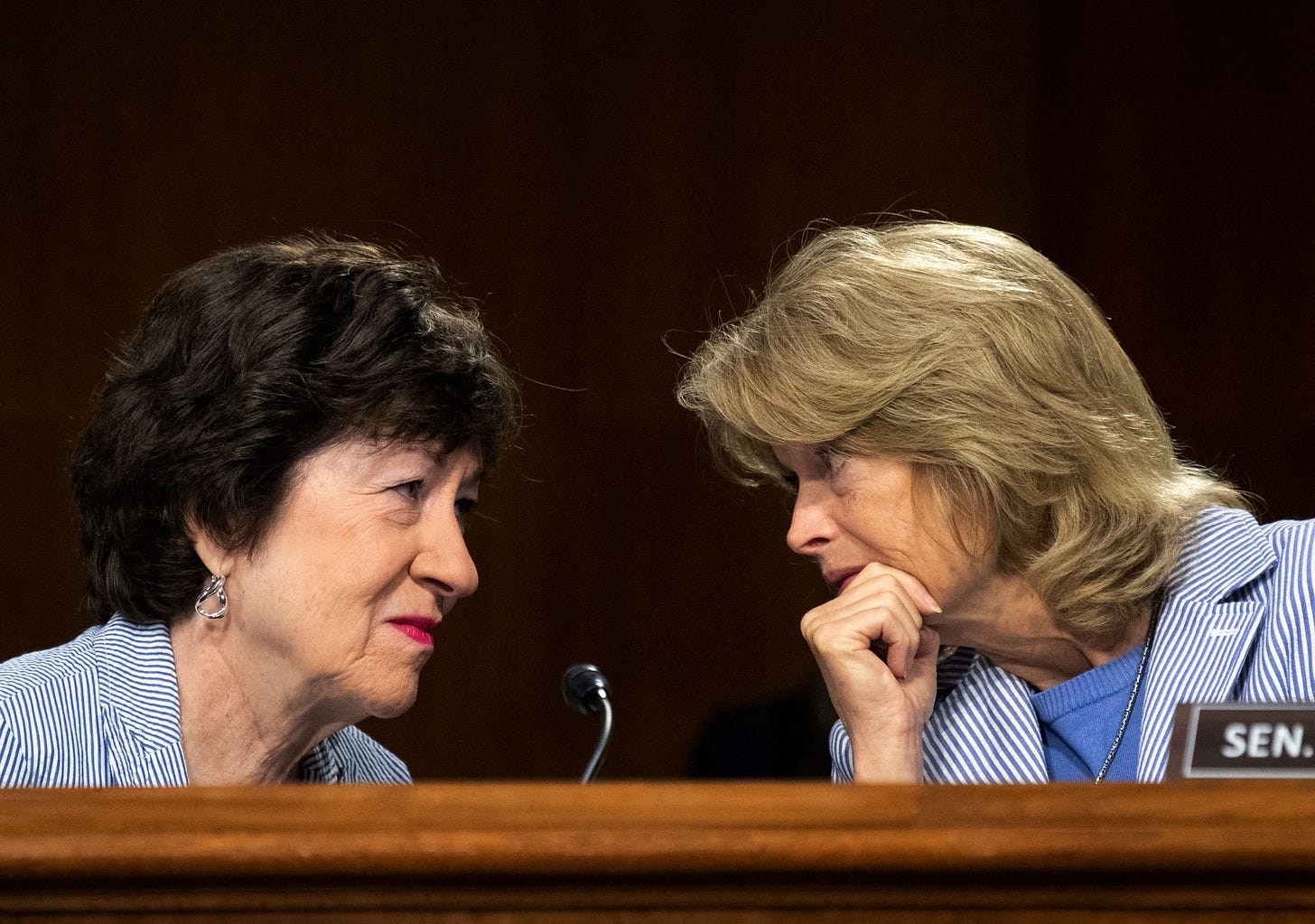 Senators Susan Collins and Lisa Murkowski talking