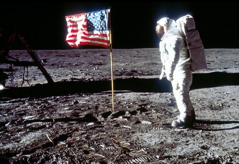 Buzz Aldrin, the second man to walk on the moon, salutes the Stars and Strips