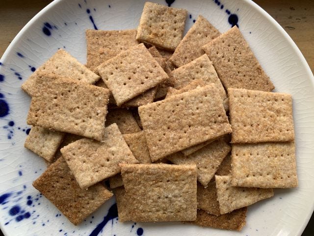 A pile of brown crispy crackers on a plate