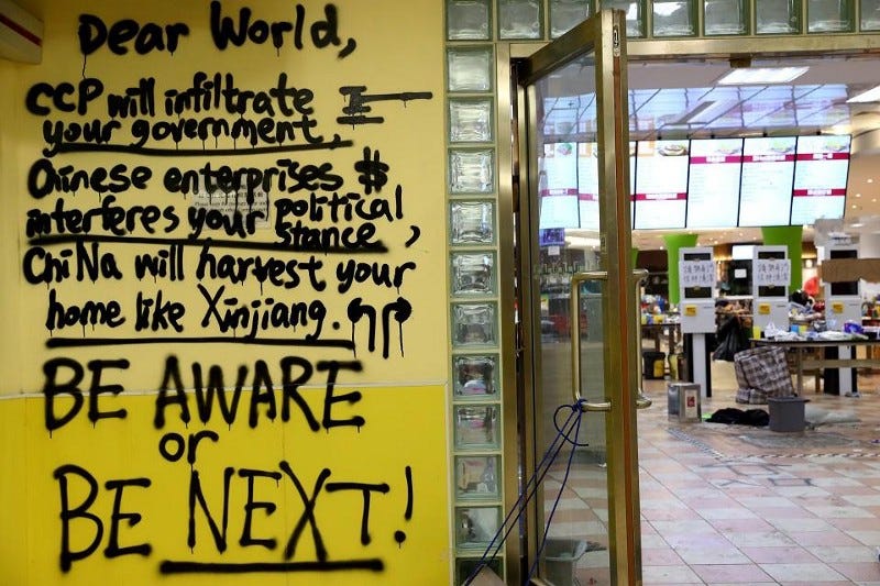A message is written in graffiti on the campus of the Hong Kong Polytechnic University (PolyU) in Hong Kong