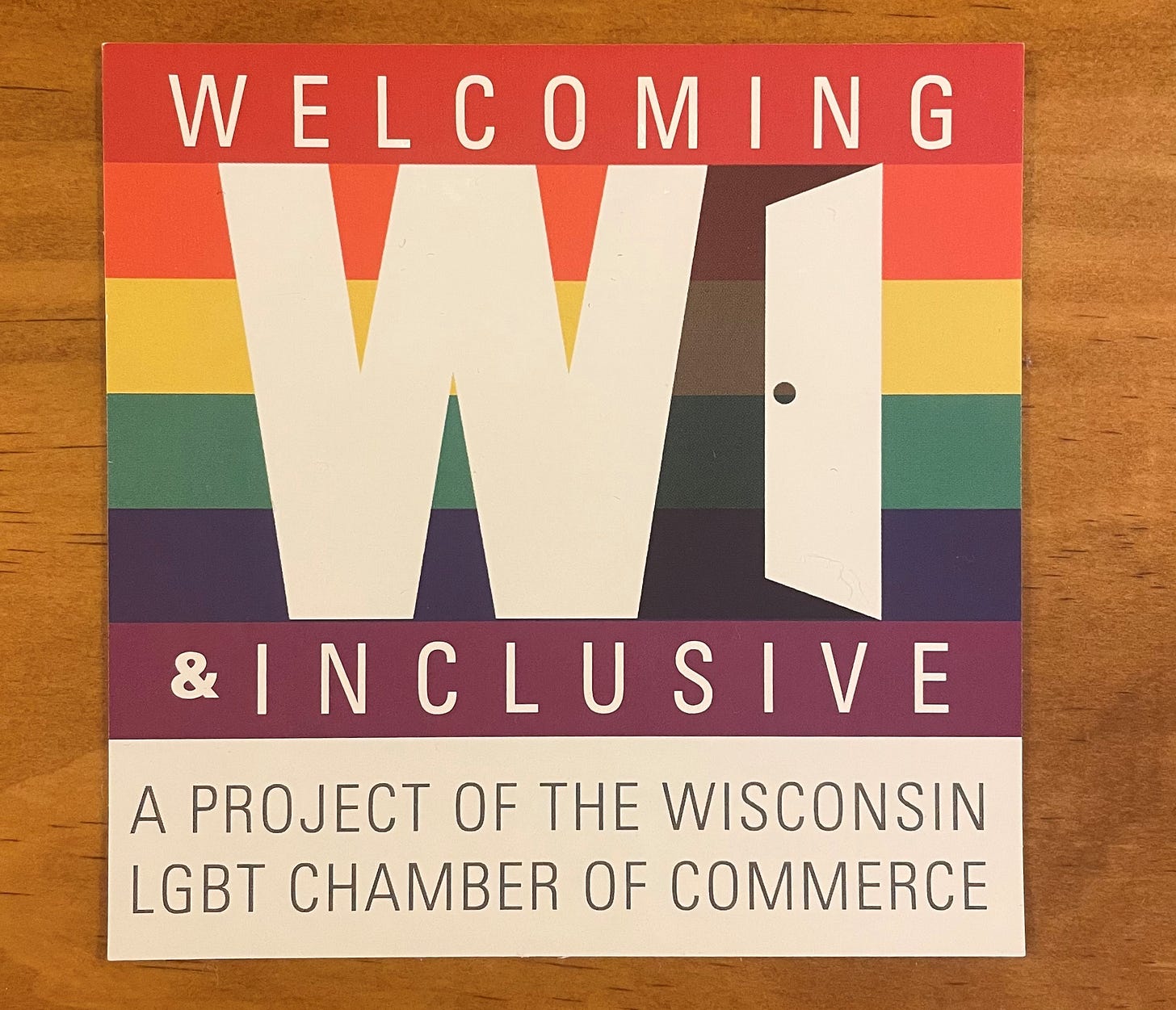 A Welcoming and Inclusive decal from the Wisconsin LGBT Chamber of Commerce. The image is described in the article text.