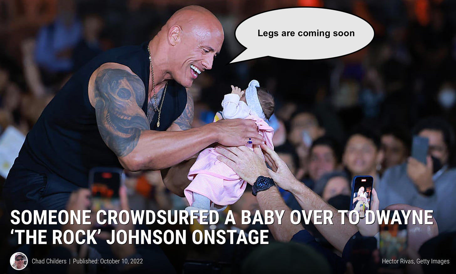 A screenshot of the title and hero image from the Loudwire story “Someone Crowdsurfed a Baby Over to Dwayne ‘The Rock’ Johnson Onstage” by Chad Childers. It has a big picture of Dwayne “The Rock” Johnson onstage, gently accepting a baby from the crowd with a huge smile, and in a word balloon he’s telling the baby: “Legs are coming soon” 
