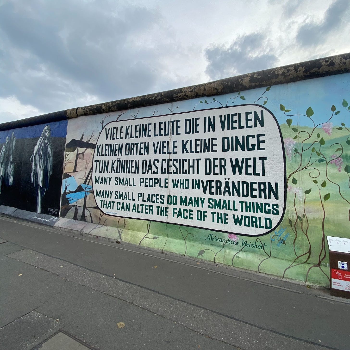 Photo of street art quote on Berlin Wall