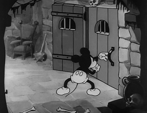 Mickey mouse opening a door and another door appear right in it's place, the same continues over and over again.