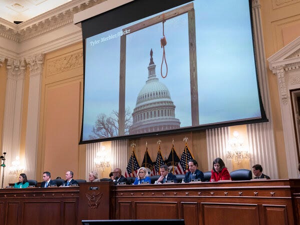 An image of a mock gallows on the grounds of the U.S. Capitol on Jan. 6, 2021, is shown on the wall behind the House select committee investigating the Jan. 6 attack on the U.S. Capitol hearing.